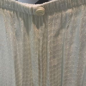 Two piece outfit. 53% acetate and 46% rayon